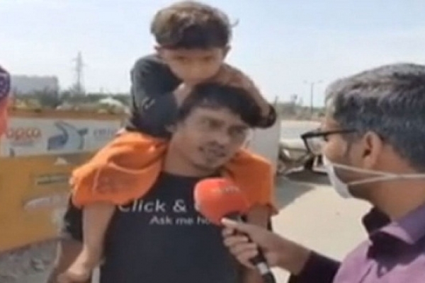 লকডাউন: ছেলেকে কাঁধে নিয়ে স্ত্রীসহ টানা দু’দিন হাঁটলেন বাবা!