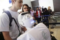 টিকিট কেটে বিমানে চড়ল রোবট