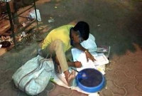 রাস্তার আলোয় তাকে আর পড়াশোনা করতে হবে না