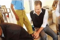  গরিব বাচ্চাদের নিজ হাতে জুতা পরিয়ে দেন জেলা প্রশাসক!