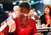 এমপির মুখে কেক ছুড়ে অভিনব প্রতিবাদ