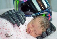 মৃত বাবার গ্লাভসের ছোঁয়ায় নিশ্চিন্তে ঘুমায় শিশু