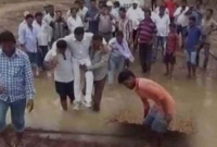 কাঁধে চড়ে এমপির এলাকা পরিদর্শন! সমালোচনার ঝড়