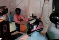 এই অফিসে হেলমেট পরে কাজ করছেন সবাই!