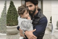 বাবার কোলে ছোট্ট মিশা