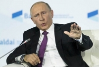 ভালো আমেরিকান হলে ট্রাম্পকে নিয়ে সমালোচনা বন্ধ করুন : পুতিন