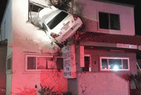 দোতলার দেওয়াল ভেঙে আচমকাই উঠে যায় গাড়ি, অতঃপর...