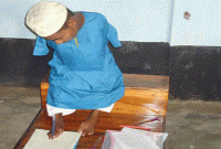 পা দিয়ে লিখে দাখিল পরীক্ষা দিচ্ছেন মেধাবী বেল্লাল!