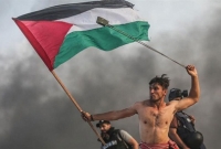 মৃত্যুর পরও এই পতাকা গায়ে জড়াতে চাই: ফিলিস্তিনি তরুণ