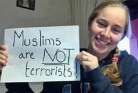 মুসলমানরা সন্ত্রাসী নয় : প্ল্যাকার্ড হাতে তরুণী