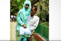 এগিয়ে যাওয়ার চেষ্টায় বাবার কোলে চড়ে এসে এইচএসসি পরীক্ষা দিচ্ছে নাইচ খাতুন