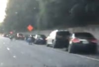 রাস্তায় ছড়িয়ে পড়া লাখো ডলার কুড়িয়ে নিতে হুড়াহুড়ি 