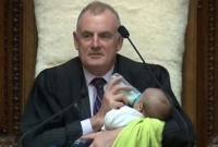 এবার পার্লামেন্টে এমপিপুত্রকে কোলে নিয়ে ফিডারে দুধ পান করালেন স্পিকার