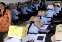নকল ঠেকাতে শিক্ষার্থীদের মাথায় দেয়া হলো কাগজের বাক্স!