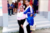 মায়ের কোলে চেপে পরীক্ষা কেন্দ্রে অদম্য সাথী