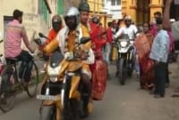 হেলমেট পরে মোটরসাইকেলে চড়ে বিয়ে!