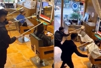 করোনাভাইরা'স আত'ঙ্কে ৪ ফুট লম্বা স্টিক দিয়ে চুল কাটছেন চীনা নাপিতরা!