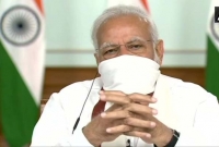 গামছায় মুখ ঢাকলেন নরেন্দ্র মোদি!