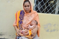 ৩৭ দিনের শিশু বাহিরে রেখে পরীক্ষার হলে মা!