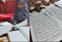 মাত্র ৮ মাসে পবিত্র কোরআন হাতে লিখলেন স্কুলছাত্রী সোমা আক্তার