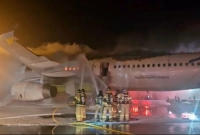 ব্রেকিং নিউজ: যাত্রীবাহী বিমানে আগুন