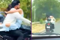 ৭৫ হাজার টাকা জরিমানা বান্ধবীকে কোলে নিয়ে বাইক চালানোয়