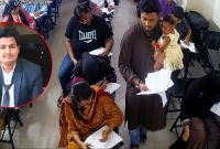 এক-অনন্য-দৃষ্টান্ত-স্থাপন-শিক্ষার্থীর-সন্তানকে-কোলে-নিয়ে-পুরো-পরীক্ষা-নিলেন-শিক্ষক